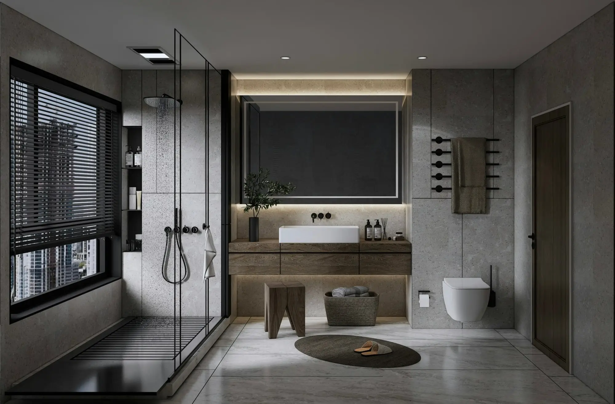 Modern bathroom in charcoal stone tones with a frameless glass walk-in shower, floating vanity and warm cove lighting